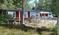 Smagfuldt indrettet sommerhus med søudsigt Smagfuldt indrettet sommerhus med søudsigt